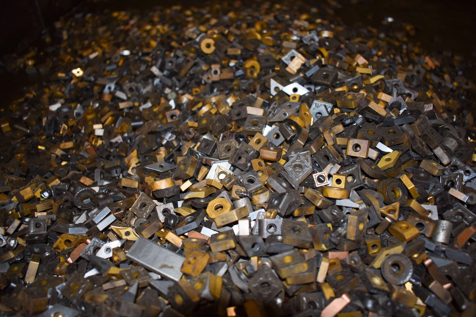 Used tungsten carbide inserts in a bin